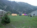 05 Fairy Meadows Campsite From Tato we hiked gradually ascending the narrow gorge of Tato River, the track clinging high on its left bank. We pass through green juniper and pine trees, and arrive at Fairy Meadows (3200m). Fairy Meadows is a spectacularly pine forested alpine meadow overlooking the Rakhiot Glacier. Its name comes from a local superstition that fairies inhabit the area.